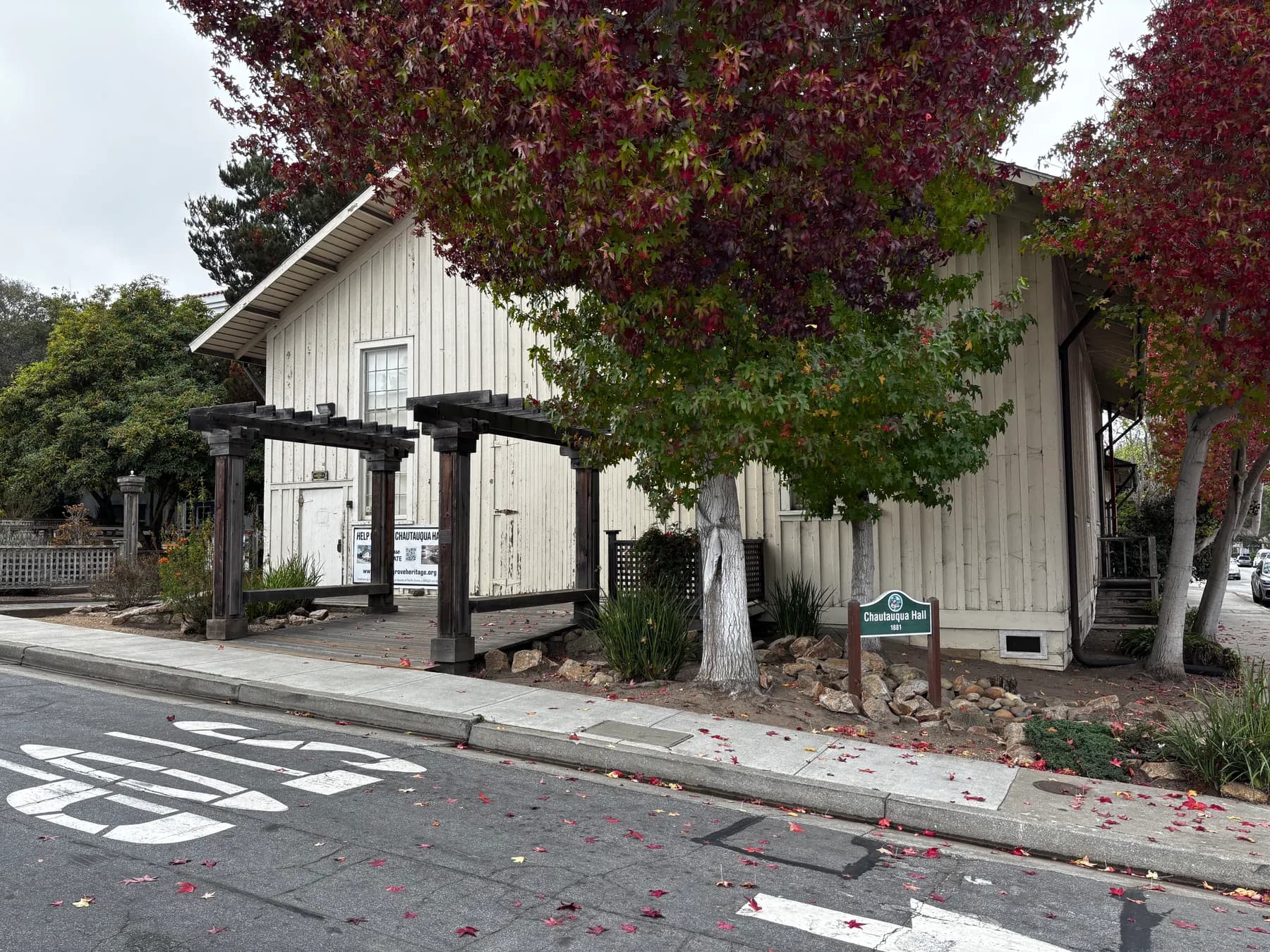 Chautauqua Hall, a simple white wooden building on a Pacific Grove corner